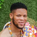 Emmanuel Chucks in native clothing, smiling